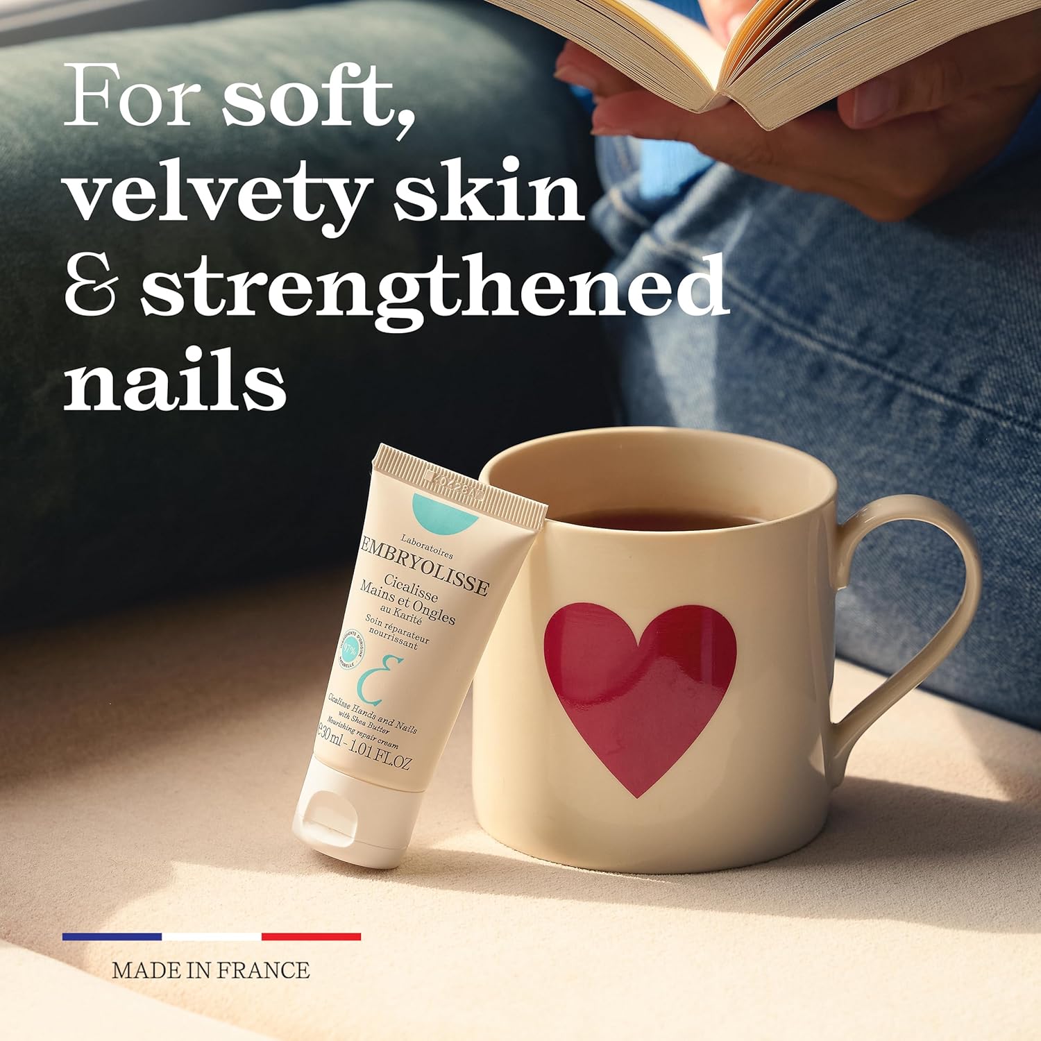 Embryolisse Cicalisse Hands and Nails skincare cream placed beside a warm mug, highlighting soft, velvety skin and strengthened nails, a daily nourishing hand care solution made in France.