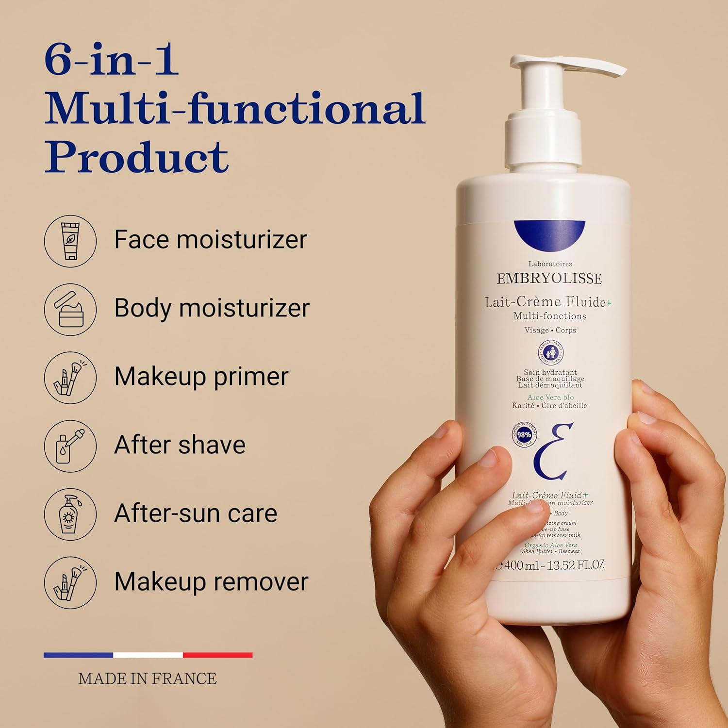 Emryolisse Lait-Fluid+ bottle benefits skincare product with hand holding it, labeled as a 6-in-1 multi-functional product.