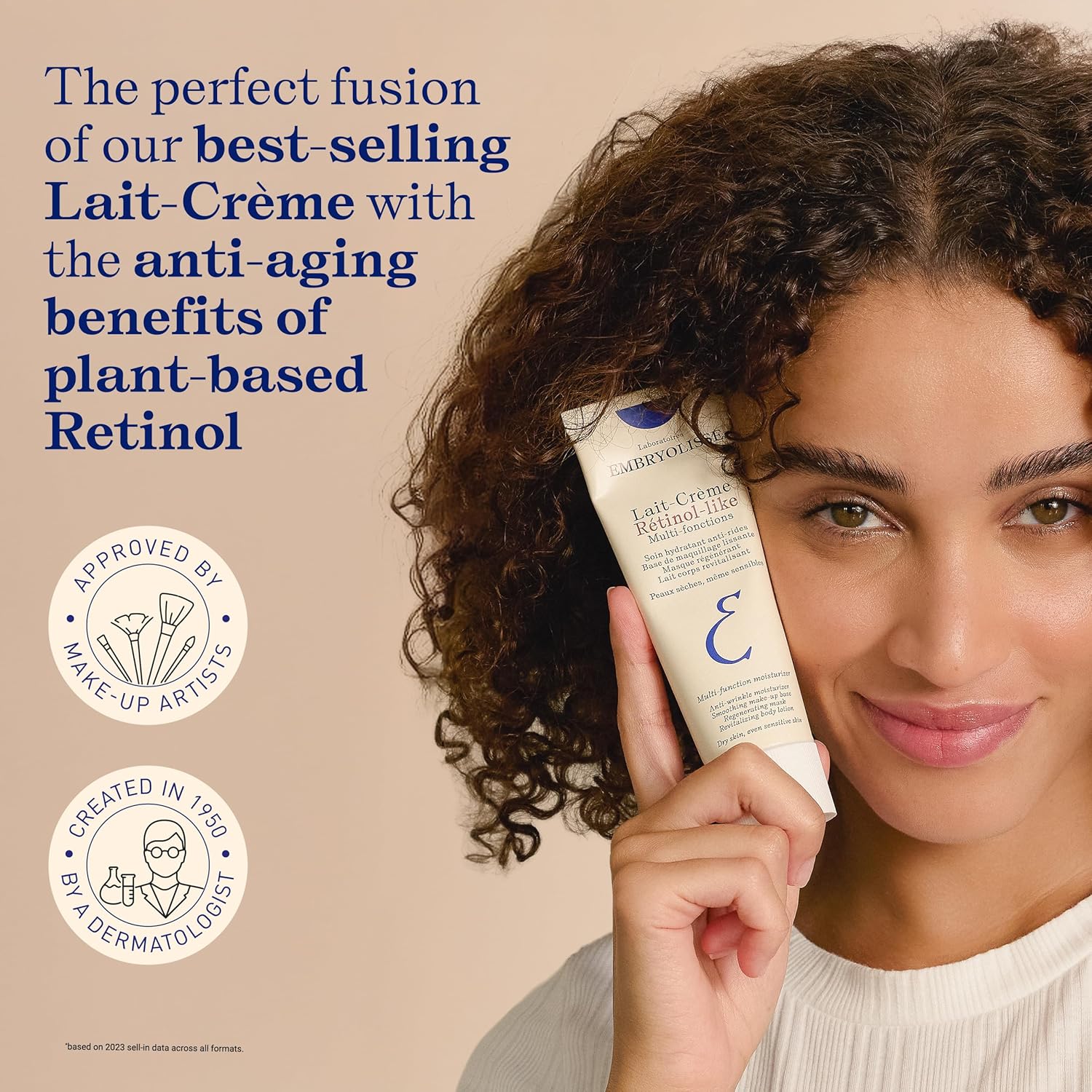 Woman holding a tube of Lait-Creme Retinol-Like with text about plant-based Retinol on a beige background