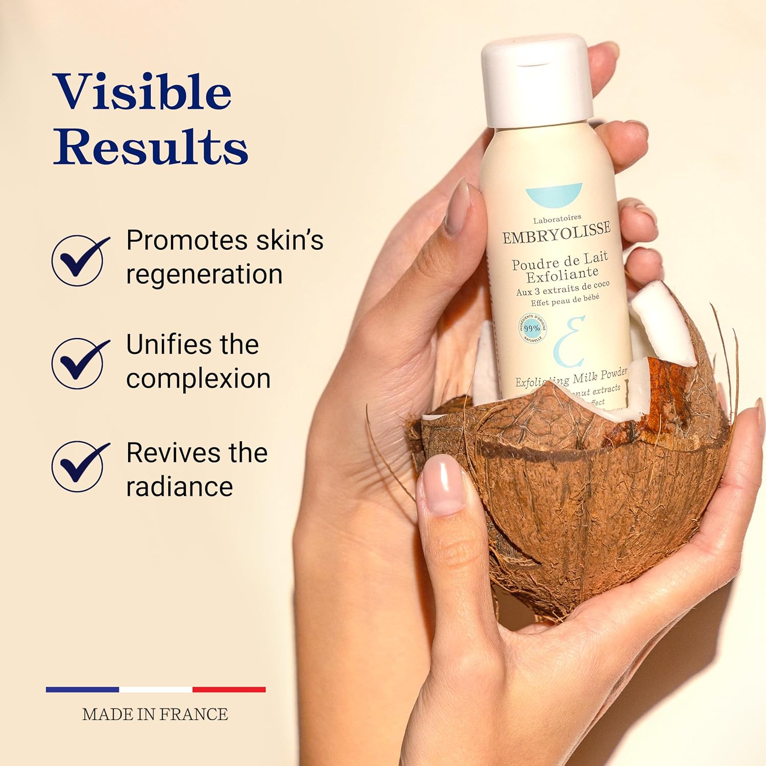 Hand holding a bottle of Embryolisse Embryolisse Exfoliating Milk Powder scrub with text on visible results.