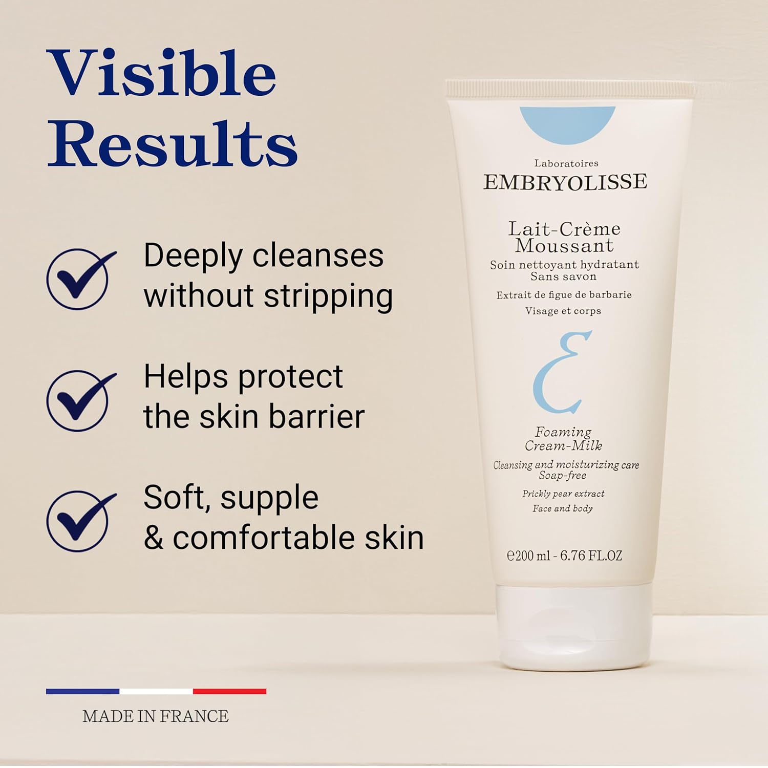 Embryolisse Foaming Cream Milk cleanser with visible results text on a beige background