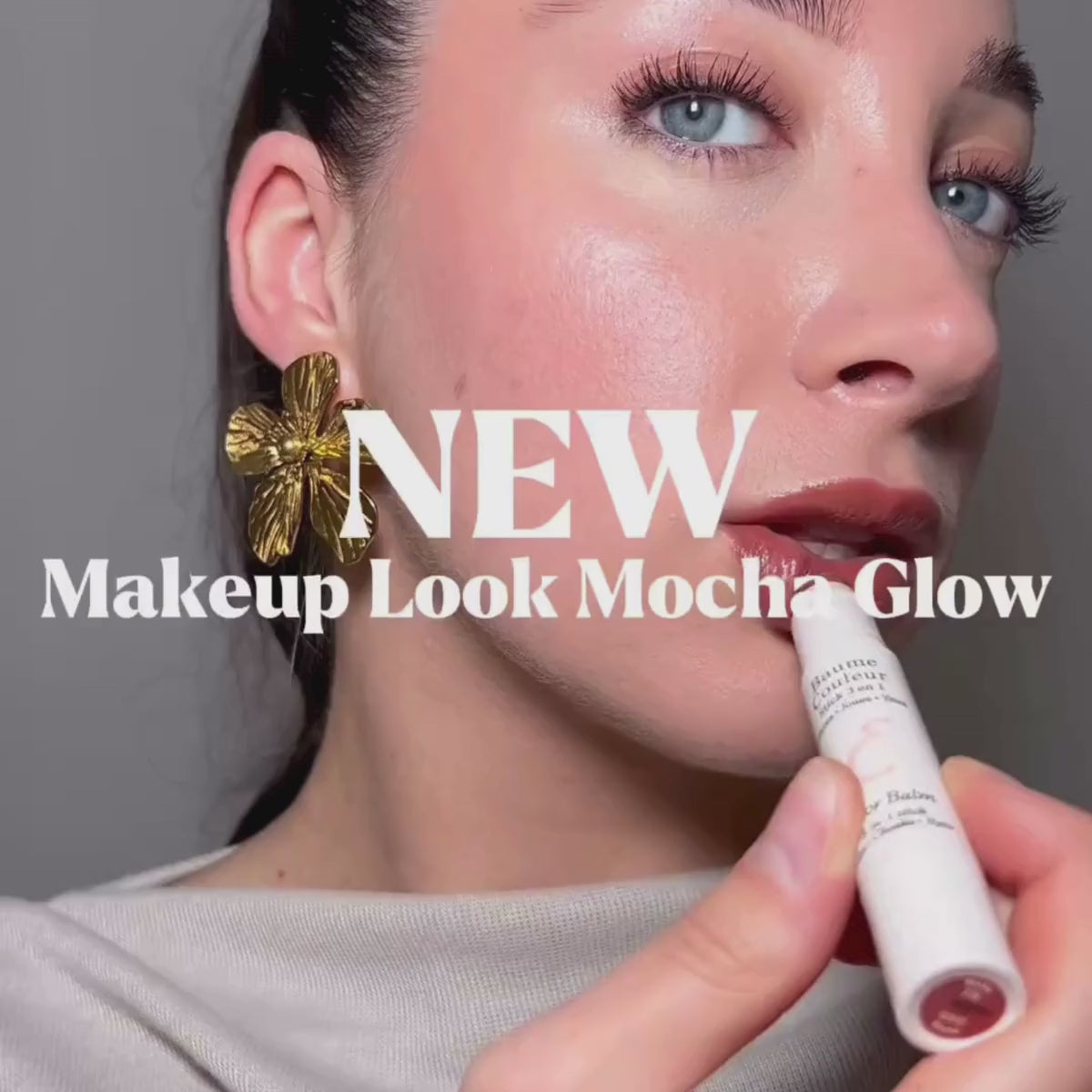 Video presenting Embryolisse Artist Secret Color Balm 3-in-1 Stick Mocha, focusing on the product texture and shade payoff through close-up application shots. It shows the balm gliding smoothly onto the skin and being gently blended on lips, cheeks, and eyes, highlighting its creamy consistency and warm mocha tone. The final result appears soft and natural, illustrating the balm’s versatility, and comfortable wear for an effortless, everyday “no-makeup” makeup look suitable for sensitive skin.